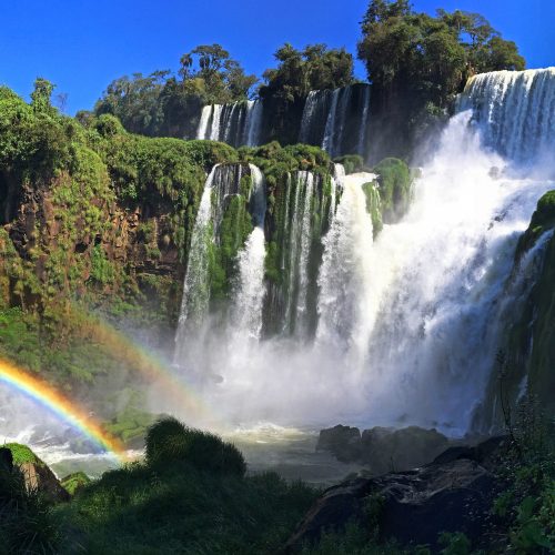 A series of waterfalls making rainbows.